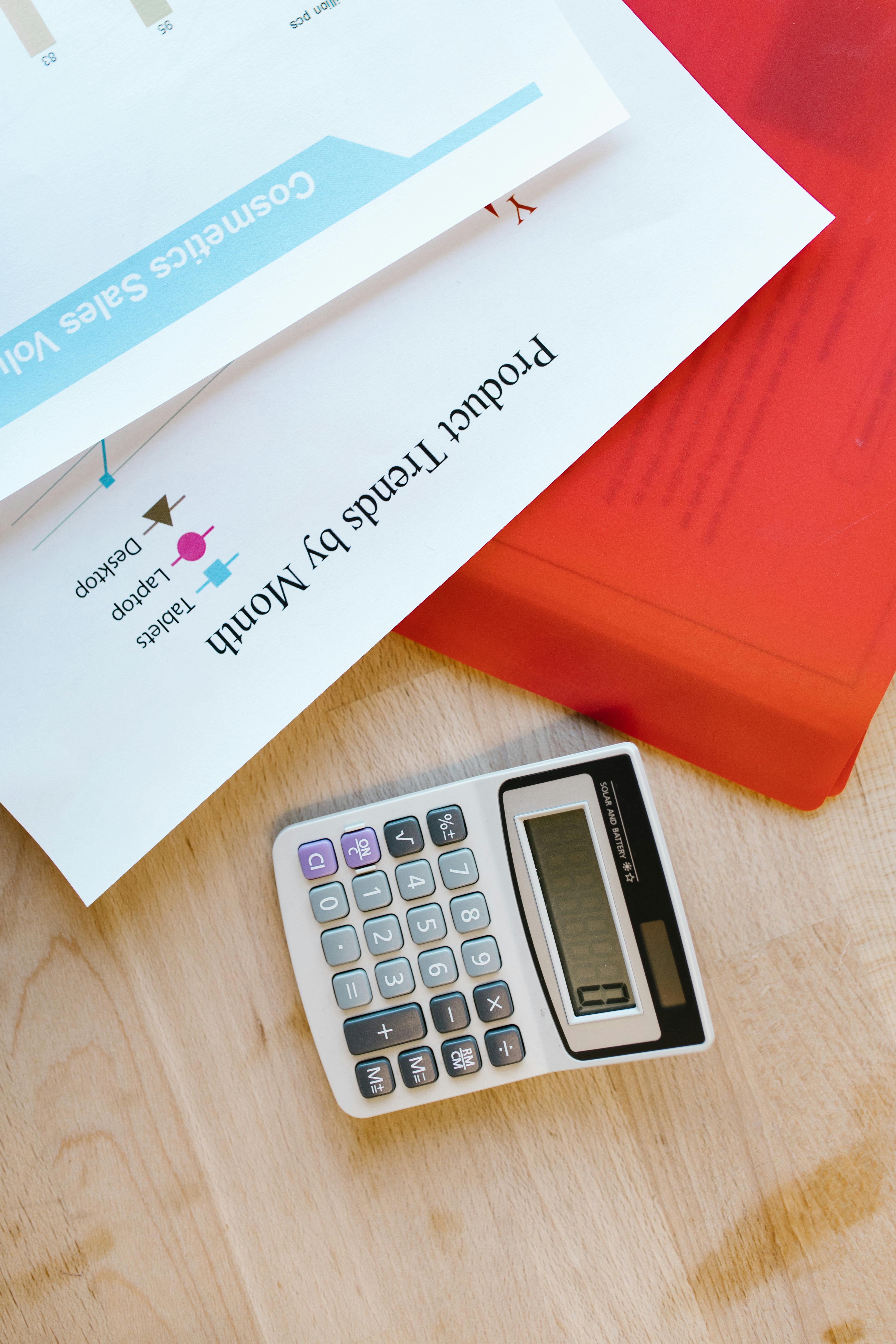 Calculator and paperwork on a tidy desk